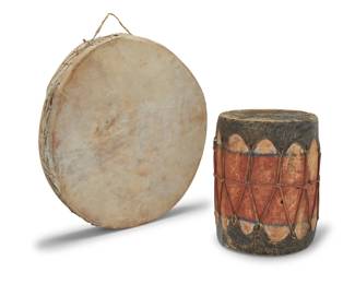 1279 A pair of Cochiti Pueblo hide drums Early 20th century Comprising a two-headed hand drum with handle, and a two-headed polychrome ceremonial drum with hide stretched over a cottonwood trunk 2 pieces Hand drum: 3.5" H x 23.75" W x 22.75" D; Ceremonial: 14.75" H x 12.25" W x 12" D Estimate: $300 - $500