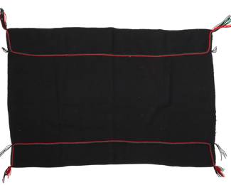 1091 A Hopi Pueblo twilled manta weaving Mid/late 20th century; Arizona Woven in black wool with applied yarn cording in red, green, and black, with cord tassels to each corner and overcast stitch to each short side 32" H x 47" W approximately Estimate: $500 - $700
