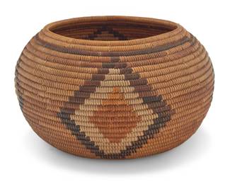 1035 A California Luiseño Mission polychrome basketry bowl Early 20th century; Southern California A four-color example, the coiled bowl with a single band above four floating diamond lozenges and a cream-colored start 5.75" H x 10" Dia. Estimate: $700 - $900