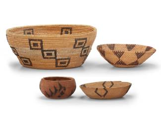 1053 An assembled group of four Great Basin baskets Early 20th century; Northern California/Nevada The coiled vessels, comprising a Washoe basketry bowl with four designs issuing from rim, a large possibly Maidu basket with six arms of offset stacked squares and an elaborate center, a Paiute basketry bowl with stacked triangles, and a Washoe single rod gap stitch basketry bowl 4 pieces Largest: 5.75" H x 14" Dia.; Smallest: 3.125" H x 5.625" Dia. Estimate: $200 - $400