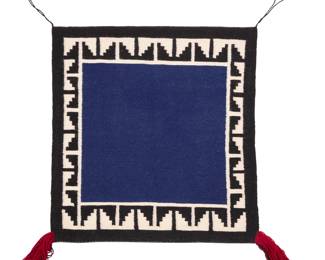 1093 A Navajo saddle blanket Late 20th century, Diné Woven in blue, black, and cream wool with red fringe accents at two corners, with a stepped border 32.75" H x 31" W Estimate: $200 - $400