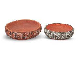 1310 Two Pueblo pottery bowls Two works: Alice Adams (b. 20th century, Hopi-Tewa) A Hopi polychrome redware low bowl, mid/late 20th century Signed and inscribed to underside: APP 45 / Alice Adams / Tewa, Village / 1st Mesa With black and white banded geometric motifs on a red ground 4.125" H x 11" Dia. An Acoma Pueblo low bowl, late 20th century With black fine-line and geometric motifs on a white slip ground, with terracotta wash interior 3.125" H x 9" Dia. 2 pieces Estimate: $200 - $400