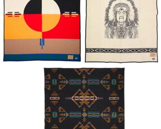 1422 Three Pendleton wool blankets Late 20th century Each with factory tag indicating fiber content; two further tagged with pattern name and inscription Comprising a "Circle of Life" blanket, designed 1992, a "Sunset Fading Away from the Swan" portrait blanket depicting Chief Clarence Burke of Walla Walla Umatilla Cayuse Tribes, Nez Perce Nation, (b. 1892), and a blanket with Native American-style designs 3 pieces Circle: 78" H x 64" W; Portrait: 79.5" H x 61.5" W; Black/brown: 77" H x 65" W Estimate: $200 - $400