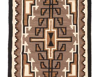 1097 A Navajo Two Grey Hills rug Mid-20th century, Diné Woven in black, cream, dark brown, brown, and natural grey wool, with central stepped diamond and stepped corners and long edge borders 47.5" H x 38" W Estimate: $300 - $500