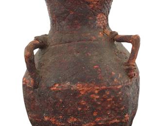 1230 An Apache basketry water vessel Late 19th/early 20th century; Southwest United States The coiled vessel with two lug handles, coated in pine pitch 8" H x 6" W x 5.75" D, irregular Estimate: $200 - $300