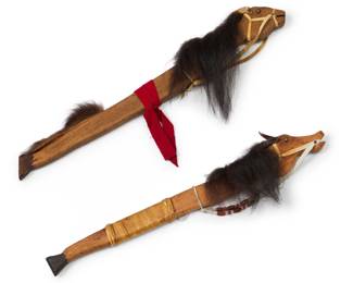 1417 Machinque Peshewa (20th Century, Shawnee) Two horsehead dance wands, mid-20th century Each signed and inscribed: MACHINQUE / PESHEWA / SHAWNEE / [indecipherable] Fur, hide, and brass tacks on carved wood, one with wood and glass beading 2 pieces Longer: 28.5" L x 3" W x 1.375" D; Shorter: 28.25" L x 3.875" W x 1.375" D Estimate: $200 - $400