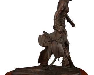 1150 Laurence H. Coffelt (1910-1976) "Saddletramp" Patinated bronze on a wood plinth Edition: 17/20 Signed, titled, and numbered in the casting: © / L. COFFELT / No. 17/20, impressed on the base: HAROLD PHIPPEN / Foundryman Bronze: 15.25" H x 12" W x 9.375" D; Overall: 16.625" H x 14.375" W x 8.625" D Estimate: $500 - $700
