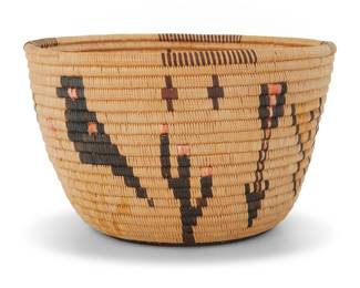 1005 A Panamint Shoshone polychrome pictorial basket Early 20th century; Great Basin The coiled basket with partial rim ticking above alternating birds on a branch, arrows, flowering cacti, and butterfly motifs, the polychrome elements including dyed quills 3.625" H x 5.875" Dia. Estimate: $1,000 - $1,500
