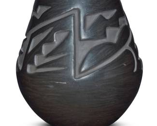 1070 Helen Shupla (1928-1985, Santa Clara Pueblo) A blackware pottery jar, mid/late 20th century Incised to underside: Helen / Santa Clara / Pueblo With deeply carved rain cloud motifs 6.625" H x 6.25" Dia. Estimate: $800 - $1,200