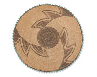 1237 A Pima beaded basketry gift tray Early 20th century, Akimel O'odham; Arizona The very finely woven coiled tray with swirling design and turquoise glass beads applied to braided rim 0.875" H x 4.25" Dia. Estimate: $500 - $700
