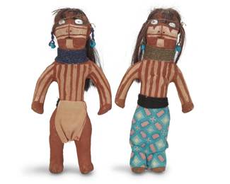 1302 Two Mojave pottery dolls In the manner of Annie Fields (1884-1971, Mojave) Each with horsehair, trade cloth, and beaded jewelry, molded in the form of a standing man and woman painted with white, cream, black, and red slip 2 pieces Each: 9.25" H x 4.5" W x 1.875" D approximately Estimate: $400 - $600