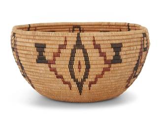 1021 A Washoe polychrome degikup basket Early 20th century; Great Basin The coiled basket with alternating diamond and geometric elements and floating hourglass motifs 4" H x 8" Dia. Estimate: $800 - $1,200