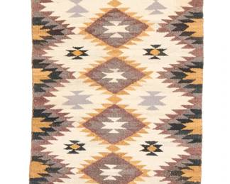 1266 A Navajo regional weaving Mid-20th century, Diné Woven in black, dark brown, natural brown, natural grey, cream, grey, and ochre wool, depicting columns of stacked serrated diamonds 38" H x 19.75" W Estimate: $200 - $400
