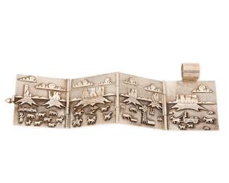 2145 A Herman Vandever Navajo sterling silver storyteller book pendant Herman Vandever (b. 1964, Diné) Late 20th/21st century Etched signature verso A four-panel silver overlay hinged storyteller pendant depicting a Navajo hogan within a Southwest landscape and farm scenes, with sheep, horses and several figures, with a large fixed bail and hook clasps to each side 3" H x 2.5" W; open: 9" W 136.6 grams gross Estimate: $500 - $700