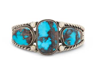 2008 A Gary Reeves Navajo sterling silver and turquoise cuff bracelet Gary Reeves (1962-2014, Diné) Late 20th/21st century Stamped: G Reeves [script] / Sterling A heavy four wire cuff with three set turquoise stones with heavy matrix, likely Bisbee, and with twisted rope wire and silver ball accents 6.75 total inner C x 1.25" H, gap: 1.25" 86.3 grams gross Estimate: $500 - $700