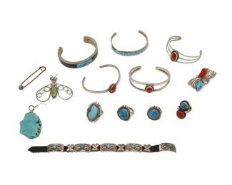 2290 A group of Southwest silver and turquoise jewelry Mid/late 20th century Two variously marked: sterling / H A large group comprising five cuff bracelets, three silver wire cuffs, each with set coral, two mosaic stone and turquoise inlay cuffs, and a diminutive mini concho belt bracelet with a buckle, set stone conchos and spacers, together with five turquoise and set stone rings in various styles and sizes including bezel set with rope wire edging, and two with set coral, as well as an insect brooch, a turquoise nugget pendant and a set turquoise safety pin 14 pieces Cuffs: 6" inner C to 5.625" inner C; Bracelet: 7.75" L x 0.5" H; Ring sizes: 6.25 to 4; Pendant: 2" H; Brooch: 1.75" H x 2" W; Pin: 2" H 163.8 grams gross Estimate: $200 - $400