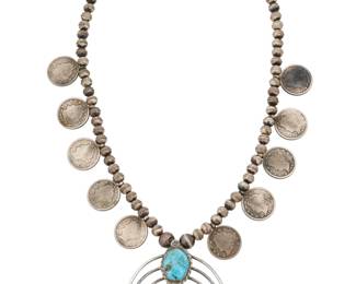 2134 A Southwest silver and turquoise squash blossom style necklace Mid-late 20th century Unmarked Comprising a single strand of silver beads with ten vintage coin 'blossoms', suspending a delicate three-wire naja with set turquoise accents 21" L x 2.75" H 87.7 grams gross Estimate: $300 - $500