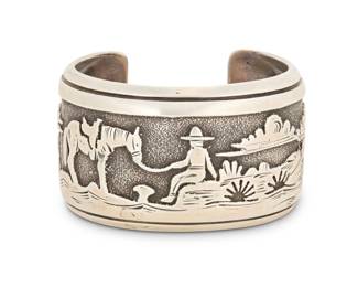 2051 A Tommy Singer Navajo sterling silver storyteller cuff bracelet Thomas 'Tommy' Singer (Dine, 1940-2014, Diné) Late 20th/21st century Stamped: Thomas Singer / Sterling A wide cuff featuring a desert landscape with clouds and horse and rider in silver overlay 7" total inner C x 1.5" H, gap: 1.125" 87.1 grams gross Estimate: $500 - $700