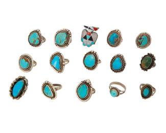 2299 A group of Southwest silver and turquoise rings Mid/late 20th century One marked for sterling Fifteen turquoise rings in various styles and sizes including bezel set with rope wire edging, one with scalloped edging, and one a Zuni-style thunderbird ring with multistone mother of pearl, coral, and turquoise inlay 15 pieces Ring sizes: 7.5 to 3.75 106.5 grams gross Estimate: $400 - $600