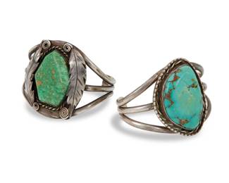 2185 Two Southwest sterling silver and turquoise cuff bracelets Mid-20th century One etched: SHC; one etched with bird pictograph Two three wire cuffs, each with a large set turquoise, and one with applied silver wire and feather accents 2 pieces Larger: 6.5" total inner C x 2" H, gap: 1"; Smaller: 6" total inner C x 2" H, gap: 1.125" 121.3 grams gross Estimate: $600 - $800