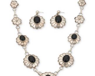 2191 A set of Southwest silver and malachite jewelry Mid/late 20th century Naja stamped with bird picto Comprising an elaborate double strand silver necklace with twelve set malachite blossoms with applied silver feather and rope wire accents, suspending a large set stone naja with blossom dangle, together with a matching three wire cuff bracelet and a ring 3 pieces Necklace: 30" L x 3.75" H; Cuff: 6.875" total inner C x 1.25" H, gap: 1.375"; Ring size: 8 366.3 grams gross Estimate: $800 - $1,200