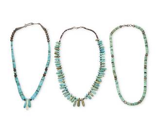 2213 A group of Pueblo style turquoise bead necklaces Mid/late 20th century Unmarked Comprising three single strand turquoise bead necklaces, including two with silver bead spacers and one of graduated turquoise tabs with heishi shell spacers 3 pieces 20" L to 19.5" L 106.7 grams gross Estimate: $300 - $500