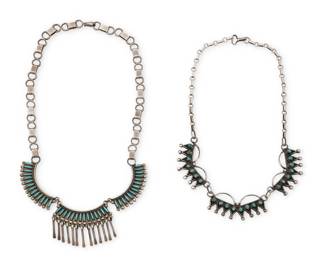 2088 Two Zuni Pueblo sterling silver and row set turquoise necklaces Mid/late 20th century Two works: Libert Peyketewa (b. 1948, Zuni Pueblo) A three link collar necklace with needlepoint turquoise Etched script verso: Libert Peyketewa / Zuni Comprising three curved links, each with row set needlepoint turquoise, the central link with silver dangles, and all suspended from a handmade paper clip chain 18.5" L x 1.375" H A Zuni Pueblo sterling silver and turquoise link necklace Unmarked With three curved links of row set petit point turquoise suspended from a handmade paper clip chain 17" L x 1" H 2 pieces 67.5 grams gross Estimate: $400 - $600