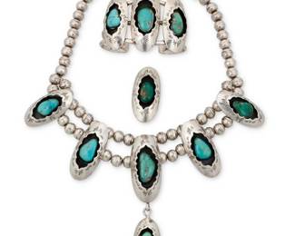 2190 A set of Bernice Bonney Navajo sterling silver and onyx concho jewelry Bernice Bonney (b. 20th century, Diné) Late 20th century Each stamped: BB / Sterling The graduated stamped silver concho link necklace, five links set with onyx cabochons, and a pair of matching earrings 3 pieces Necklace: 20.5" L x 1.375" H; Earrings: 1.5" H 96.1 grams gross Estimate: $300 - $500