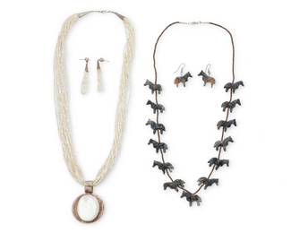 2277 A group of Southwest silver and carved stone jewelry Late 20th century Unmarked; owner's tag indicates John Garcia, Diné as artist Four works comprising a Navajo carved greystone horse fetish necklace with heishi spacers (27" L), and a pair of matching earrings (1.5" H), all attributed to John Garcia, together with a multistrand mother-of-pearl heishi bead necklace suspending a sterling silver and set mother of pearl pendant (26.5" L x 2.5" H) with a pair of matching bead earrings (2.5" H) 6 pieces 130.8 grams gross Estimate: $500 - $700