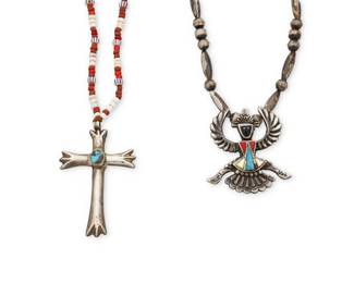 2162 Two Southwest style sterling silver necklaces Mid/late 20th century Each unmarked Comprising a single strand mixed trade bead necklace with a cast sterling silver cross pendant with set turquoise (23" L x 2.5" H), and a cast sterling silver 'Knifewing' figure pendant with turquoise, coral, and mother of pearl inlay, suspended from a single strand silver bead necklace (20.75" L x 2" H) 2 pieces 74.5 grams gross Estimate: $300 - $500