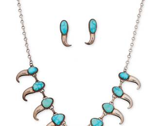 2194 A set of Southwest sterling silver and turquoise 'bear claw' jewelry Late 20th century Unmarked Two works comprising a silver link necklace with graduated set possibly Morenci turquoise 'bear claw' style links suspended from a paper clip chain, and a pair of matching earrings 3 pieces Necklace: 28.5" L x 1.5" H; Earrings: 1.625" H 91.5 grams gross Estimate: $400 - $600