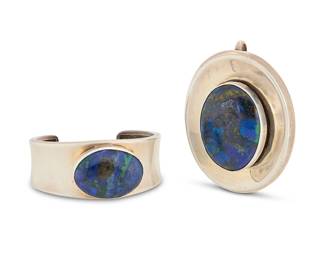 2150 A set of Herman Vandever Navajo sterling silver and azurmalachite jewelry Herman Vandever (b. 1964, Diné) Late 20th/21st century Each with etched signature verso Two works comprising a modernist style chunky silver cuff bracelet with large bezel set azurmalachite cabochon, as well as a large matching silver pendant with set azurmalachite 2 pieces Cuff: 6.25" total inner C x 1" H, gap: 1.125"; Pendant: 2.75" H x 2.125" W 150.9 grams gross Estimate: $500 - $700