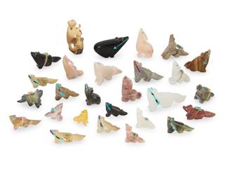 2324 A large group of Zuni carved coyote fetishes Mid/late 20th century, mostly Zuni Pueblo Some variously incised with initials From artists including Harriet Byers, Jeff Eriacho, Fred Weekoty, and Abby Quam, carved from hardstone, jet, tagua nut, and pipestone; twelve with inset turquoise, coral, or jet heartlines, ten mounted with offerings 27 pieces Largest: 2.25" H x 1" W x 0.875" D; Smallest: 0.875" H x 0.75" W x 0.375" D Estimate: $200 - $400