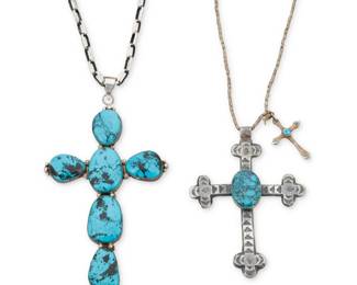 2268 Two Southwest sterling silver and turquoise cross pendants Mid/late 20th century Each marked for sterling; the smaller marked for artist: Barton [script] Comprising a large multistone cross pendant suspended from a sterling silver paperclip chain (30" L x 6.5" H x 3.75" W), and a smaller cast sterling silver cross pendant with geometric stampwork accents and a central set turquoise cabochon, suspended on a silver-tone bead chain, with a second sterling silver cross to end (31" L x 4.125" H x 3.5" W) 2 pieces 216.3 grams gross Estimate: $500 - $700