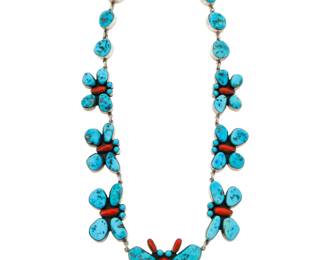 2057 A Federico Jimenez turquoise and coral butterfly necklace Federico Jimenez (b. 1941, Mixtec) Late 20th/21st century Stamped: JF [conjoined] / Sterling A chunky link necklace with graduated cluster set turquoise and coral butterfly links suspending a large central butterfly pendant 24" L x 1.875" H 192.0 grams gross Estimate: $800 - $1,200
