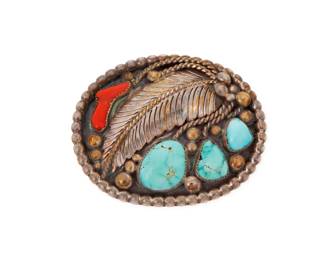 2006 A Eugene Martinez Paiute sterling silver and set stone belt buckle Eugene Martinez (b. 20th century, Paiute) Late 20th century With etched initials EM and leaf and arrow marks verso Comprising a chunky oval buckle with three set turquoise stones and a set branch coral, with silver feather and silver ball overlay accents and edging 2.75" H x 3.25" W 106.7 grams gross Estimate: $200 - $400