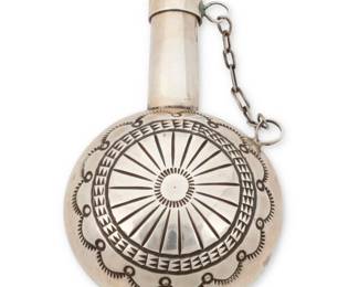 2014 A Southwest sterling silver flask Mid-20th century Unmarked The small vessel with stampwork to each side and a narrow spout with lid secured with a handmade chain 2.75" H x 1.75" W x 1" D 30.3 grams gross Estimate: $200 - $400