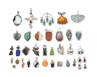 2303 A group of Southwest style silver and set stone pendants Mid/late 20th century Variously marked for maker and or sterling: TJC / Lona Northerner / Citlal Castillo, Mex / CR,CP [Relios] / SH / DTr / A / RG [conjoined] A large group of pendants in various shapes, styles and stones, most set in silver, some cluster set or stacked, and including malachite, opal, various agates, lapis lazuli, tiger's eye, mother of pearl, amethyst, shell, greenstone, and druzy stones 36 pieces Largest: 2.625" H; Smallest: 0.375" H 343.7 grams gross Estimate: $300 - $500