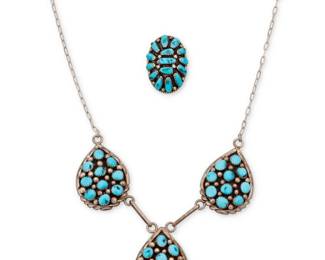2257 A group of Southwest sterling silver and cluster set turquoise jewelry Late 20th century Each stamped: Sterling; Further stamped: necklace: M [possibly Melissa Yazzie, Navajo/Diné]; ring: NJ [conjoined, possibly Leroy Navajohn, Navajo/Diné] Comprising a cluster set turquoise link necklace with three teardrop plaques suspended from a delicate link chain, together with a cluster set turquoise ring 2 pieces Necklace: 20.5" L x 1.75" H; Ring size: 8 54.0 grams gross Estimate: $300 - $500