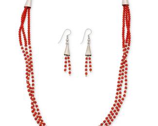 2266 A set of Kewa sterling silver and coral jewelry, attributed to Ed Aguilar Ed Aguilar (1941–2006, Kewa/Santo Domingo Pueblo) Late 20th century Unmarked (owner's tag indicates artist) Comprising a delicate three-strand necklace of diminutive handmade coral beads alternating with hand-pulled silver tube beads, with ovoid silver cone and chain closure, and a pair of matching earrings 3 pieces Necklace: 21.5" L; Earrings: 2.25" H Estimate: $300 - $500