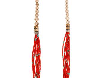 2047 A Thomas Singer Navajo multi-strand coral necklace Thomas "Tommy" Singer (1940-2014, Diné) Late 20th/21st century Marked to hangtag: T Singer [script] / Sterling An eight-strand coral necklace, each strand with scattered silver and turquoise beads, featuring terminals with two large mixed metal barrel beads with wave and banding overlay motifs, and sterling silver beads with cone clasp 31.75" L 132.4 grams gross Estimate: $800 - $1,200