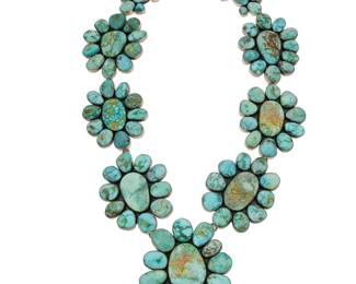 2055 A Federico Jimenez sterling silver and turquoise concho style link necklace Federico Jimenez (b. 1941, Mixtec) Late 20th/21st century Stamped: JF [conjoined] / Sterling A chunky sterling silver necklace of large cluster set turquoise concho links suspending large central concho pendant 25.5" L x 3.25" H 496.6 grams gross Estimate: $1,000 - $1,500