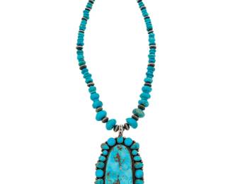 2115 A LaRose Ganadonegro Navajo silver and turquoise necklace LaRose Ganadonegro (b. 1956, Diné) Late 20th/21st century Stamped: La [rose cipher] / Sterling A graduated strand of turquoise and silver beads suspending a large turquoise cluster set pendant 18" L x 3.5" H 110.9 grams gross Estimate: $800 - $1,200