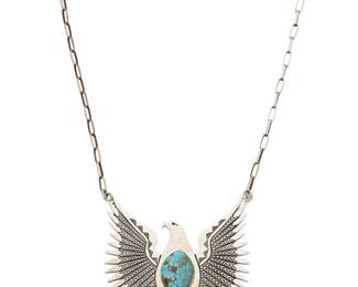 2152 A Herman Vandever Navajo sterling silver eagle pendant necklace Herman Vandever (b. 1964, Diné) Late 20th/21st century Etched signature verso Featuring a large incised silver eagle pendant with a central set turquoise cabochon, suspended from a paperclip chain 21" L x 3.375" H 93.7 grams Estimate: $300 - $500