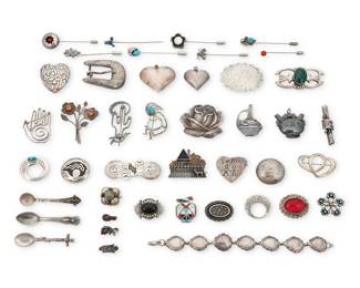 2304 A group of Southwest silver jewelry Mid/late 20th century Many variously marked for sterling and one for maker: Cini / Western Silversmiths [buckle] / Mexico / Peru / AM [conjoined, for Angeline Miller, Navajo/Diné] / GS A large group comprising thirty brooches/pins, eight stick pins, three pendants, a belt buckle, and a link bracelet, some with set stones including turquoise, malachite, coral, and mother of pearl, all in various styles, including chased silver, bezel set stones, silver overlay feather accents, stampwork, cluster set, stone inlay, and in various motifs including floral, pictorial, pottery motifs, conchos, cactus, heartline bear, thunderbird, Kokopelli, Rainbow Guardian, Northwest coast totems, and hearts and a house 43 pieces Largest brooch: 1.75" H x 2" W; Smallest: 0,75" H x 0.25" W; Pendants: 2" H to 1.5" H; Bracelet: 7.5" L 325.8 grams gross Estimate: $200 - $400