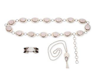 2227 A group of Southwest style sterling silver and pink mother of pearl jewelry Mid/late 20th century Necklace stamped: Sterling Three works in sterling silver and set mother of pearl comprising a pendant necklace, a two-wire cuff with mother of pearl and black stone, and a sterling silver link concho belt 3 pieces Necklace: 24" L x 3.25" H; Cuff: 6.5" total inner C x 1.125" H, gap: 1.25"; Belt: 34-40" L x 1.25" H 243.1 grams gross Estimate: $500 - $700
