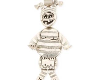 2153 A Herman Vandever Navajo sterling silver Koshare clown pendant Herman Vandever (b. 1964, Diné) Late 20th/21st century Etched signature verso The large silver articulated sculptural Koshare clown pendant with silver overlay and stampwork accents, on a detachable bail 4.125" H x 2" 51.6 grams gross Estimate: $300 - $500