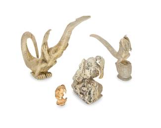 2317 Four Zuni carved dragon fetishes Mid/late 20th century, Zuni Pueblo Most variously incised with signature or initials From artists including Lewis Malie, Max Laate, and Esteban Najera, carved from hardstone, antler, or tagua nut 4 pieces Largest: 5.5" H x 5.5" W x 2.375" D; Smallest: 1.75" H x 0.875" W x 0.875" D Estimate: $300 - $500