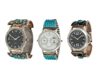 2309 A group of Southwest silver and stone set watch bands with watches Mid/late 20th century The silver ends variously marked: V.M.B. / L [within C] Comprising three silver and set stone two-piece watch band end sets, including a Valentino & Matilda Banteah (b. 1955, Zuni Pueblo) Zuni cluster set petit point turquoise set (each: 1.5" H x 1.75" W), one set with blackened silver and turquoise and coral set stones and a clasp closure (6.25" inner C x 1" H, with clasp closed), and one set with row set turquoise in a grid style (each: 1.875" H x 1.125" W), each attached to a different watch face, and two attached to an expandable metal strap 3 pieces 194.2 grams gross Estimate: $300 - $500