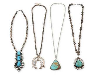 2270 A group of Southwest silver necklaces Early/mid-20th century One marked for artist: PT [boot cipher] Comprising four necklaces including a Patrick Taylor Navajo/Diné sterling silver and set turquoise pendant on strand of sterling silver beads (22" L x 2.5" H), a long sterling silver pendant/brooch with three set turquoise stones, on a strand of silver beads (18.5" L x 3.5" H), a cast sterling silver Rainbow Guardian naja-style pendant suspended from a strand of small sterling silver beads (22" L x 2.25" H), and a set turquoise pendant on an associated chain (24" L x 2.25" H) 4 pieces 170.2 grams gross Estimate: $500 - $700